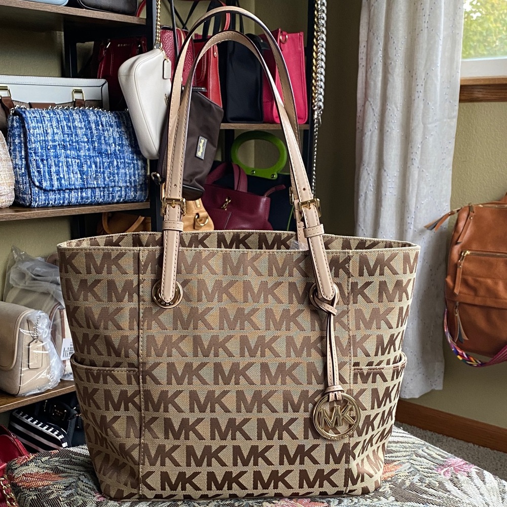 EUC Michael Kors Beige MK logo canvas tote with gold circle logo charm.